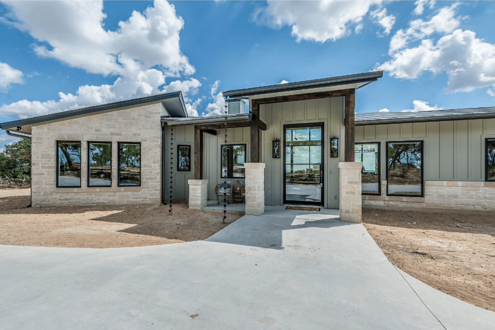 Central Texas Hill Country home with professional seamless gutters protecting against Austin rainfall