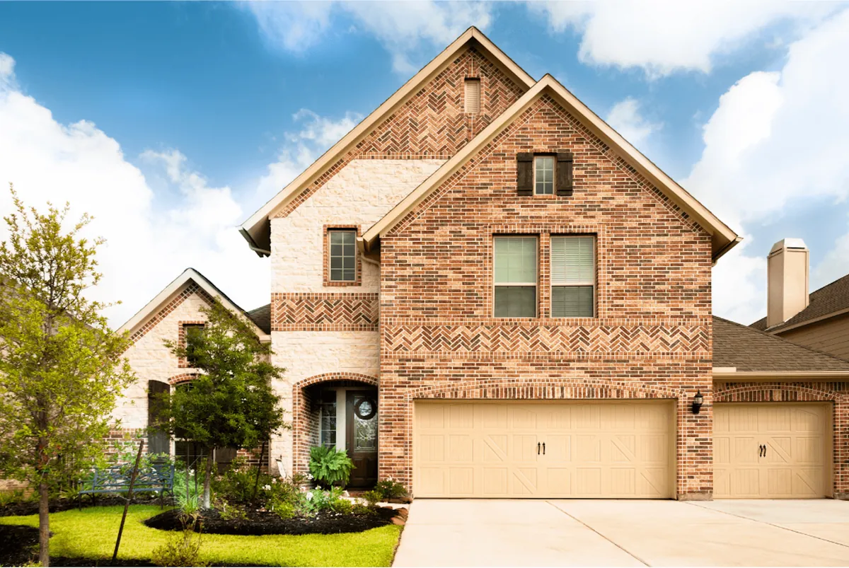 Two-story brick home with seamless gutters in Oak Hill, Southwest Austin