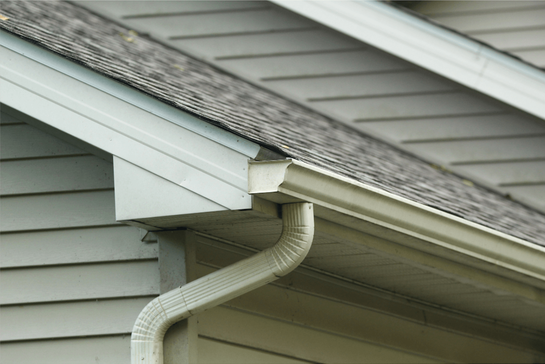 A seamless gutter installed on the roof of a home